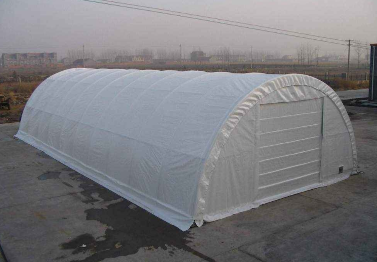 30x65x15 white PVC fabric storage building, arched steel frame, end wall with a door
