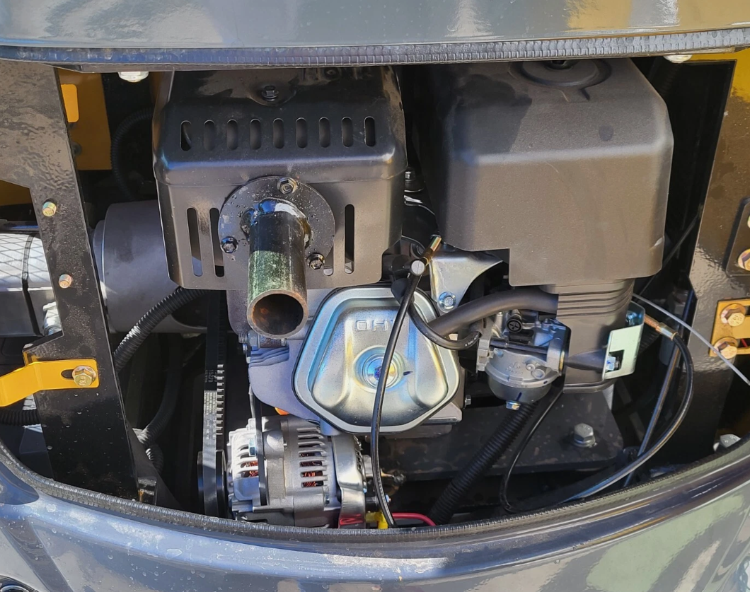 QK18RXS-C mini excavator engine bay: gasoline engine with alternator, muffler and air cleaner under the open cover