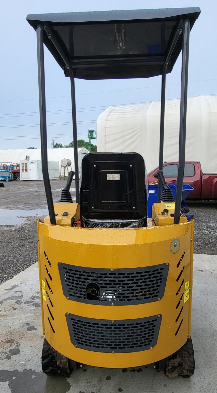 Yellow AGT H15 mini excavator from behind: black canopy over the seat, twin joysticks and engine grille