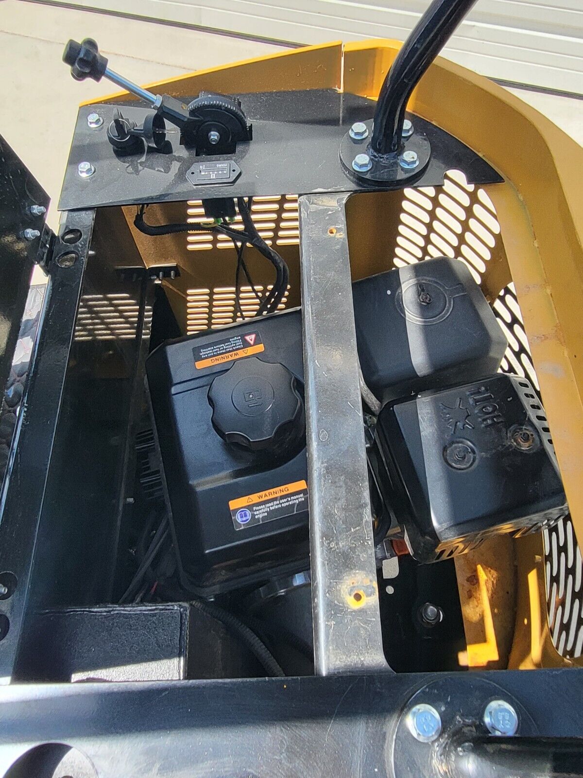 AGT H12R mini excavator engine bay: fuel tank and cap, air cleaner, shielded muffler and throttle lever