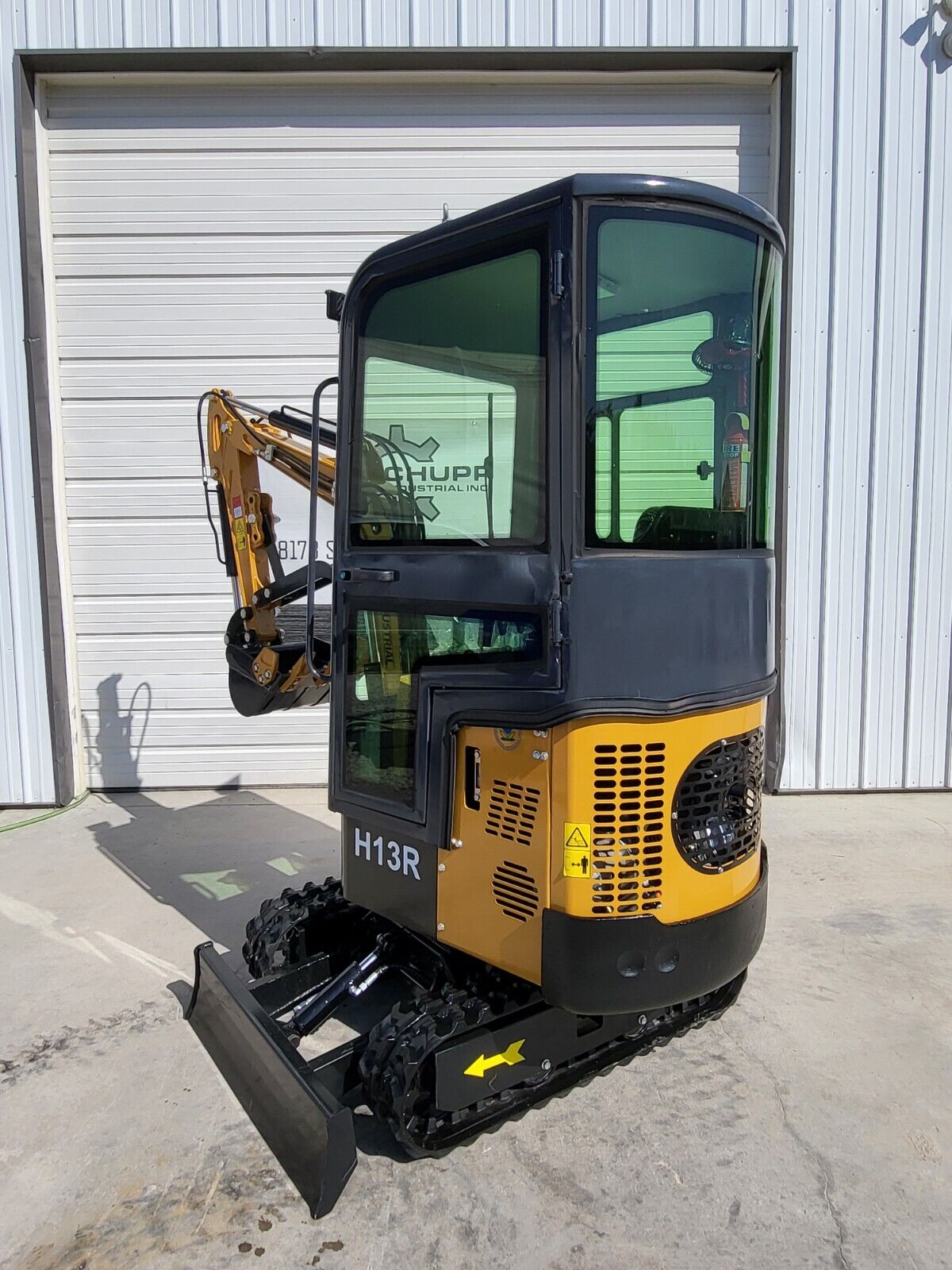 AGT H13R mini excavator: enclosed glass cab, vented engine housing, dozer blade and rubber tracks