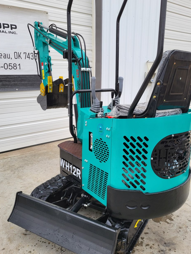 WH12R mini excavator rear engine cover with vented side panels, operator seat and backfill blade