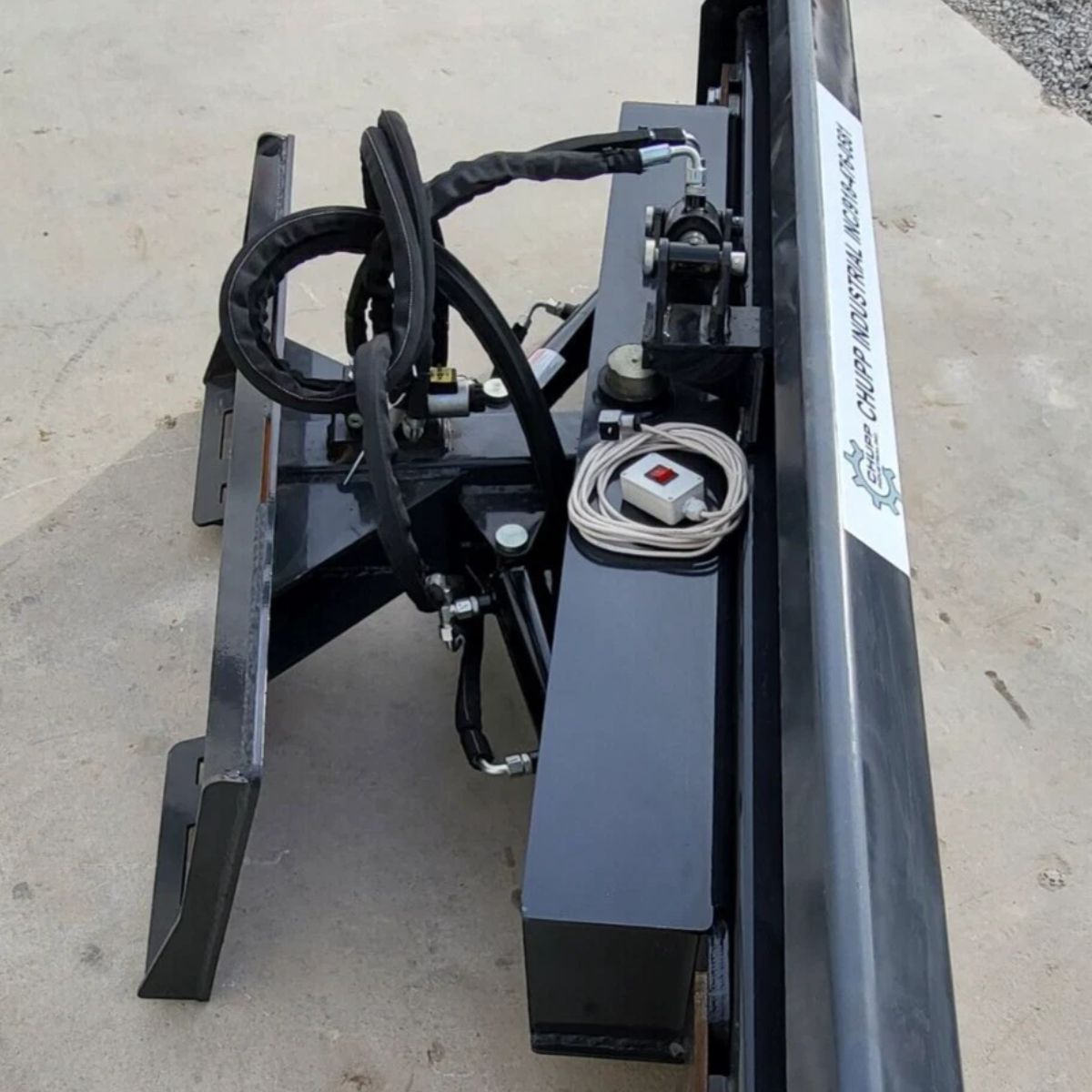 Wolverine 6-way dozer blade, back side: A-frame, hydraulic cylinders, hoses and a wired rocker control switch