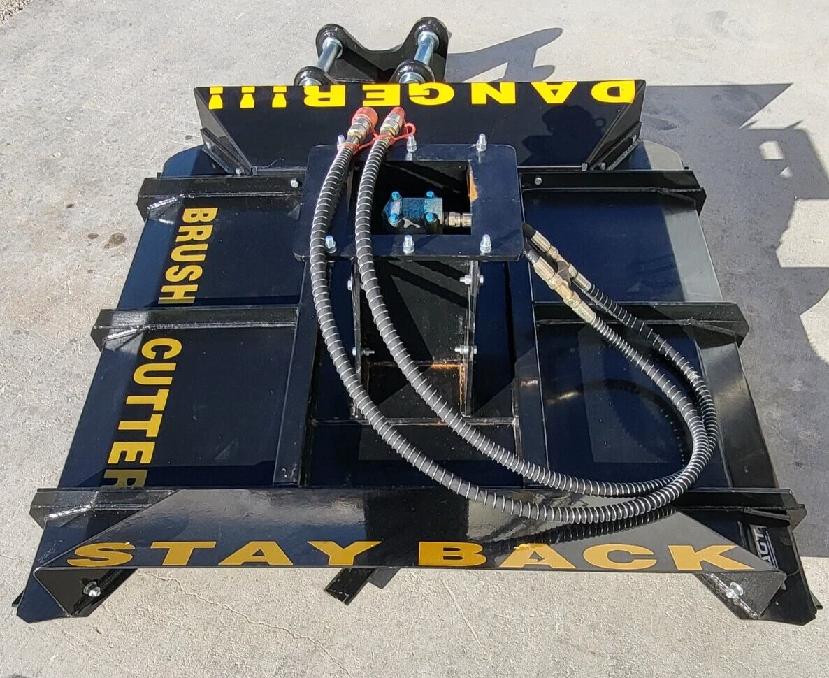 Brush cutter deck with twin mounting pins, hydraulic valve, hoses and yellow DANGER and STAY BACK lettering