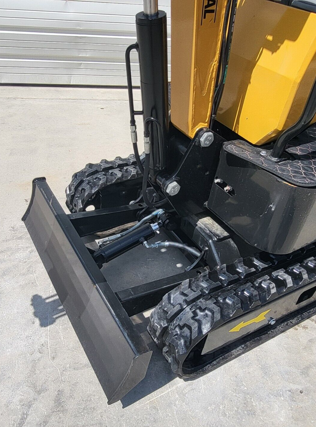 Backfill blade and blade cylinder on the AGT H12R mini excavator, with the boom swing cylinder and tracks