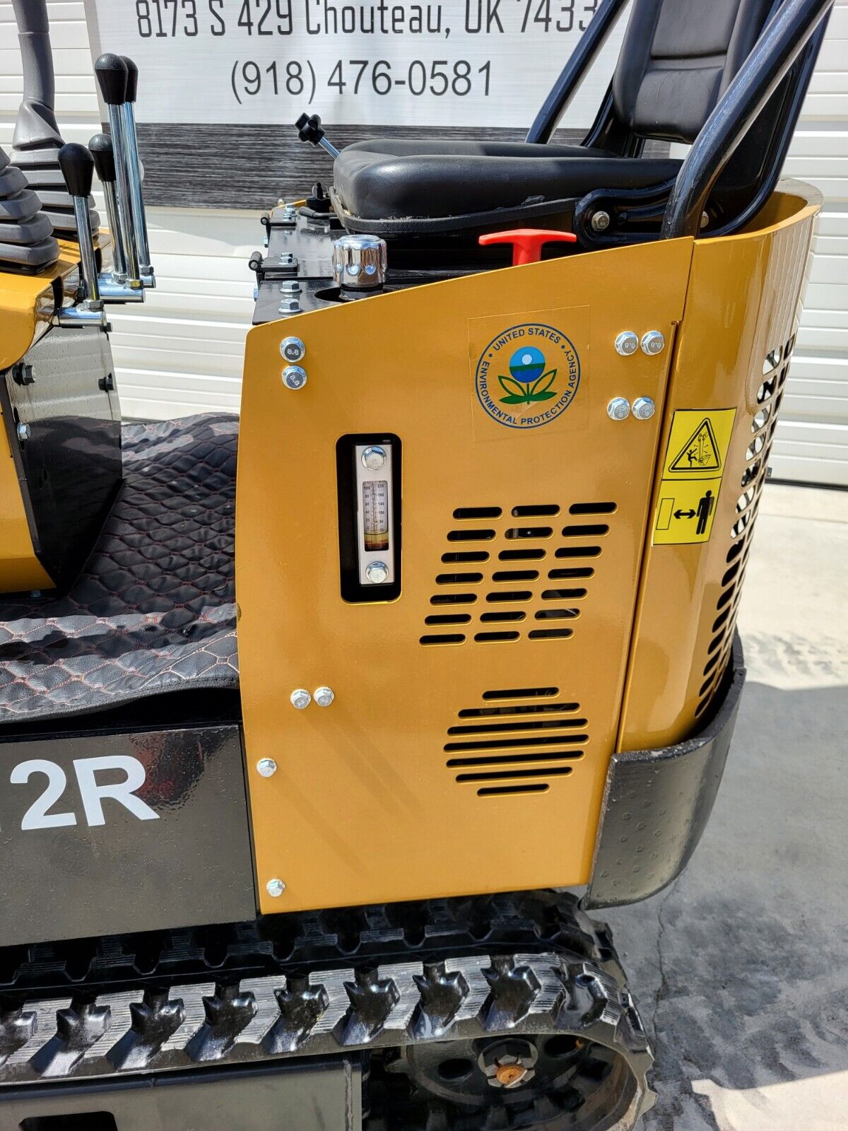 AGT H12R mini excavator side panel with hydraulic oil sight gauge, cooling vents and red shutoff handle
