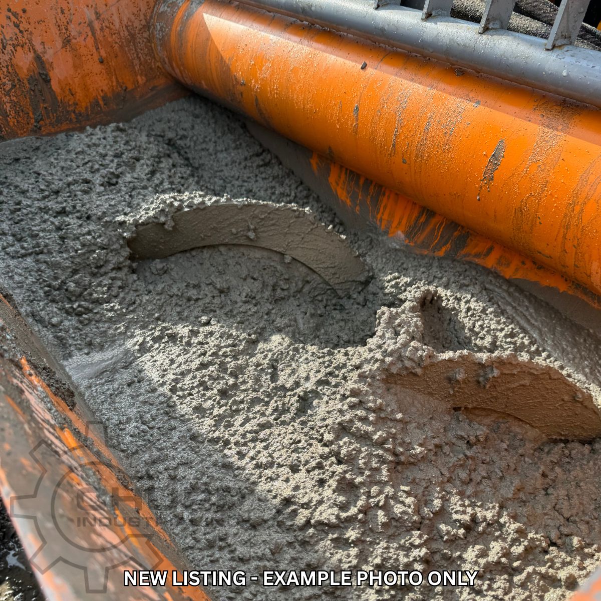 Landhonor cement mixer drum turning wet concrete, orange paddle shaft working through the batch; example photo