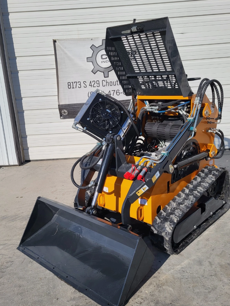 ATS-T460 mini skid steer with the engine hood open, showing the engine, oil cooler fan and hydraulic lines