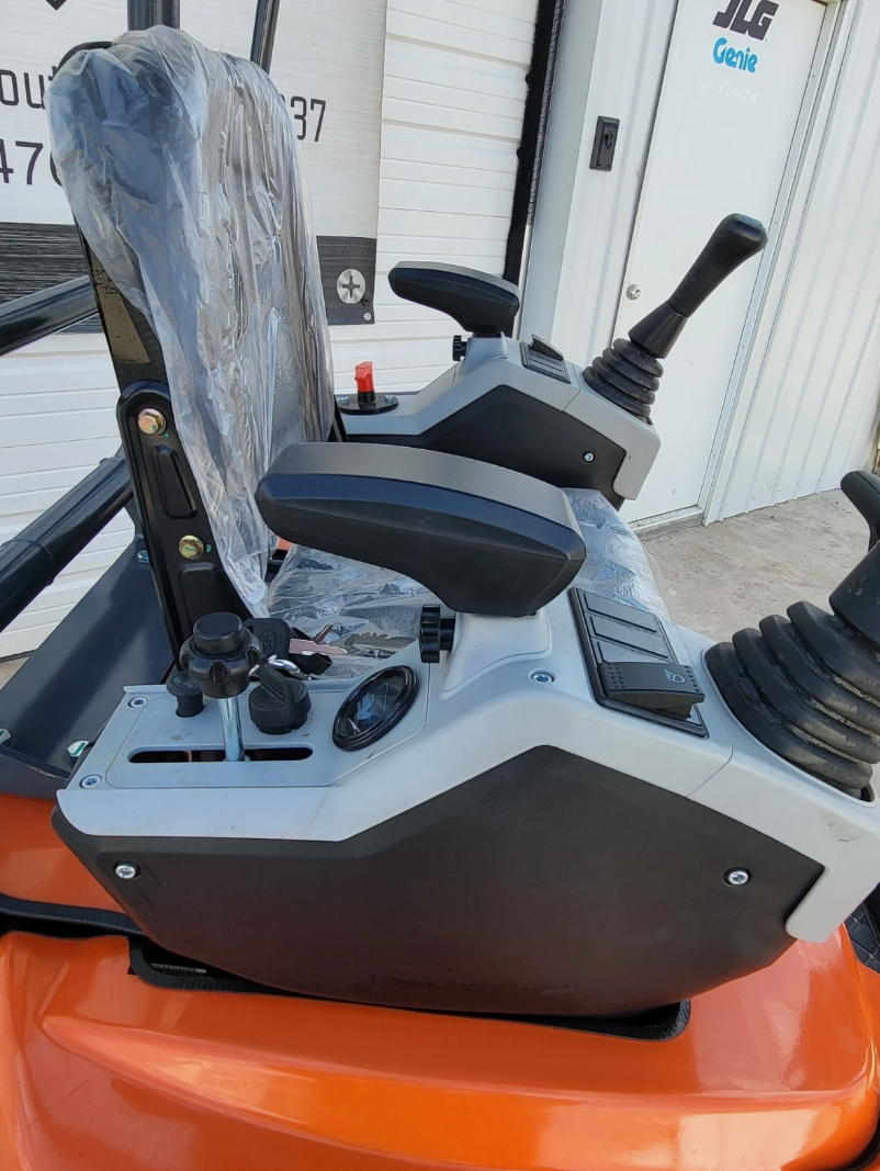 ATS-ME18 mini excavator operator station: twin joysticks, key switch, control panel and padded seat