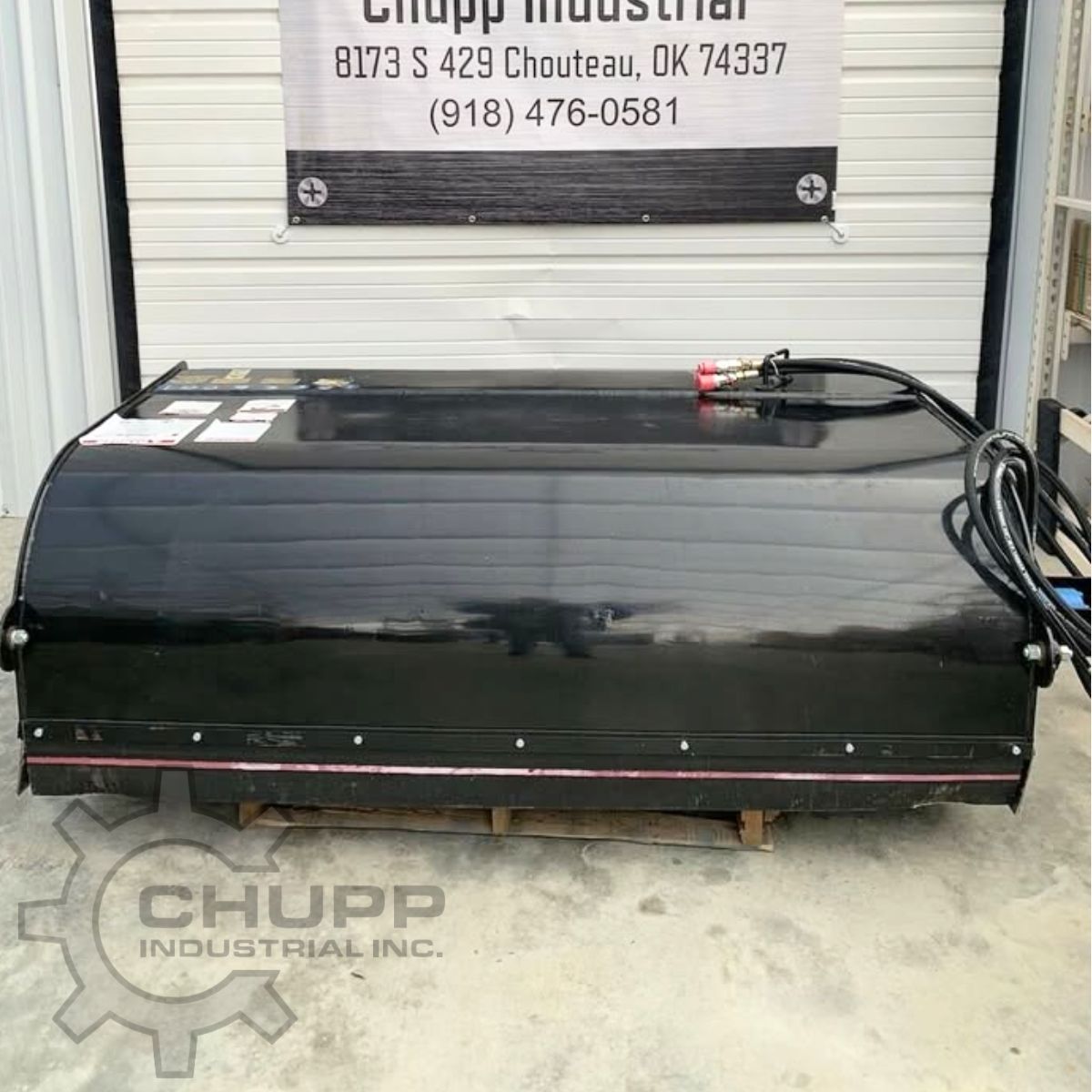Mower King 72-inch box broom on a pallet, hydraulic hoses coiled at the quick-connect couplers