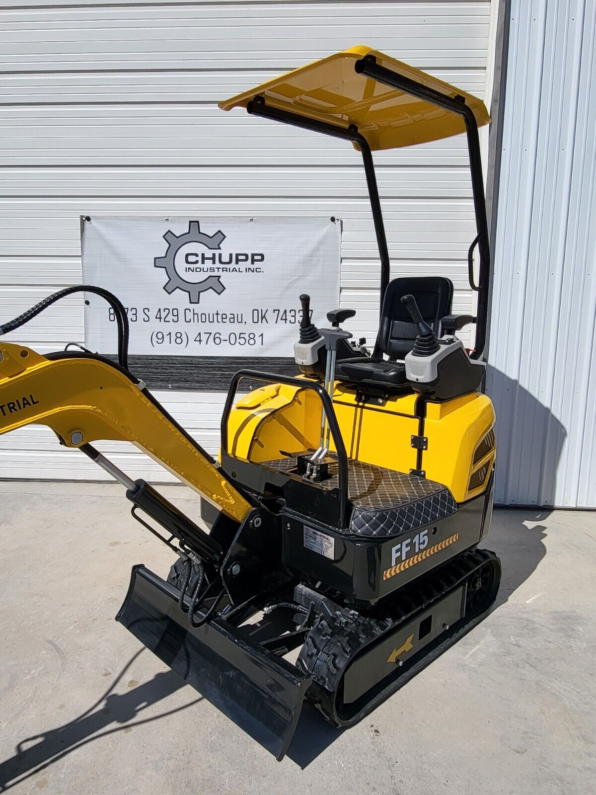 FF Industrial FF15 mini excavator: yellow canopy over the seat, twin joysticks, backfill blade and rubber tracks