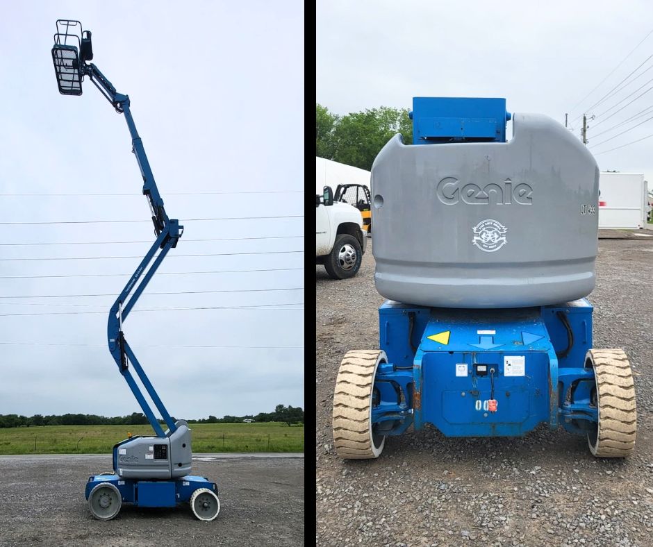 Blue Genie articulating boom lift raised to full height, with a rear view of the Genie turret cover and treaded tires