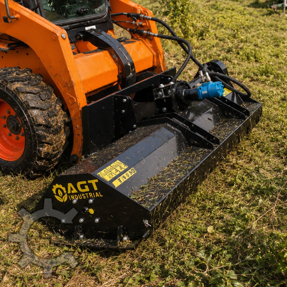 AGT flail mower mounted on an orange skid steer, cutting grass; blue hydraulic drive motor and hoses at the deck