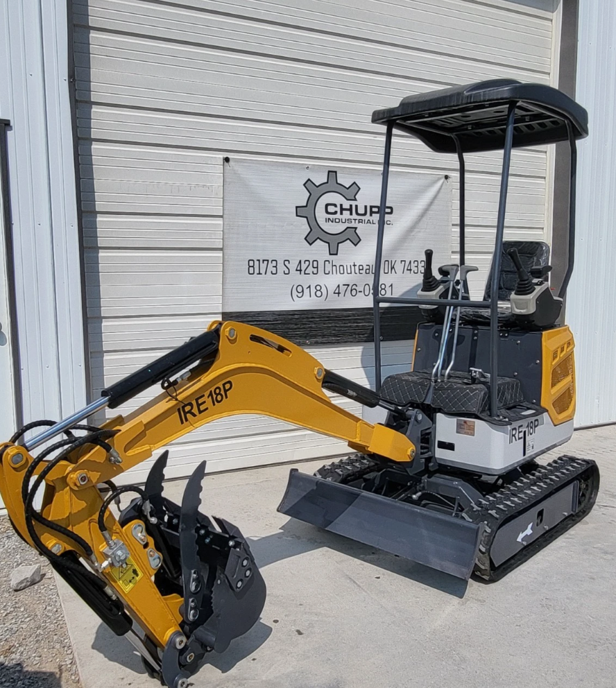 IRE18P mini excavator with boom extended, toothed bucket and thumb, dozer blade and rubber tracks