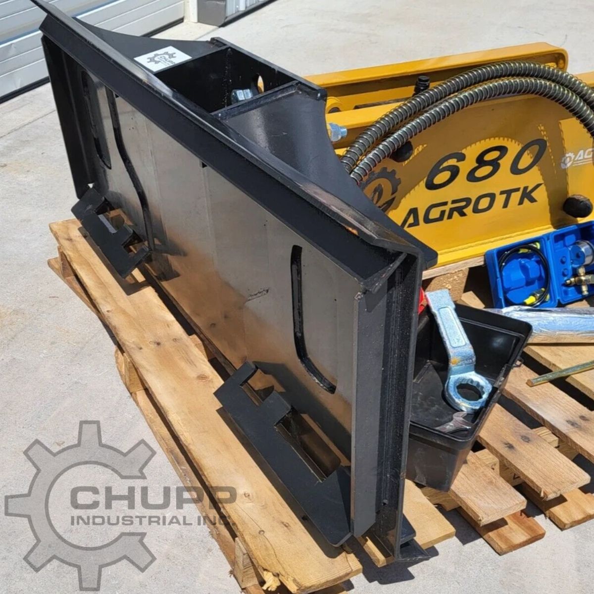 AGROTK 680 breaker hammer with its universal skid steer mounting bracket, hoses, toolbox and greasing wrench