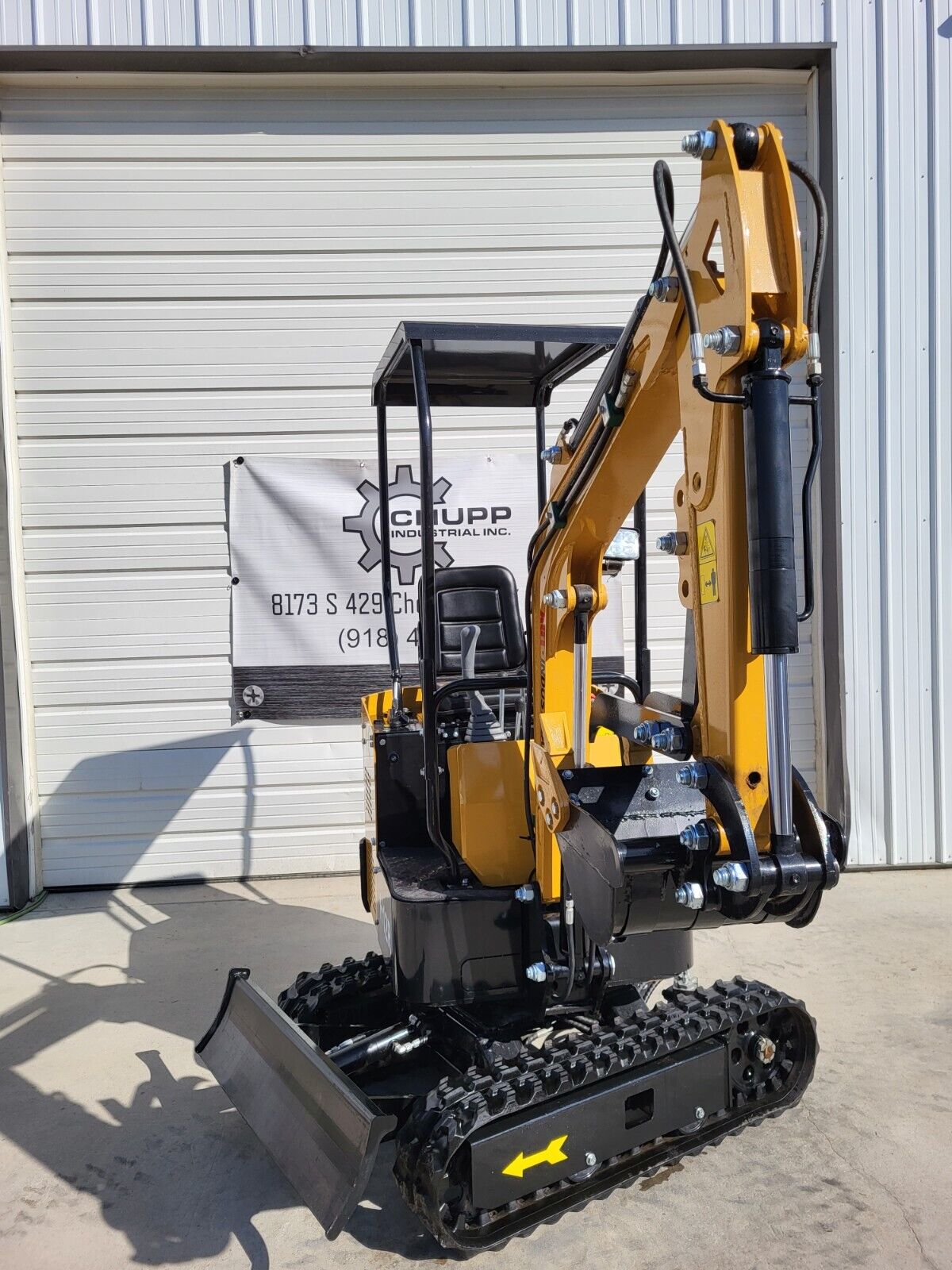 AGT H12R mini excavator with boom and arm raised, bucket removed, backfill blade, canopy and rubber tracks