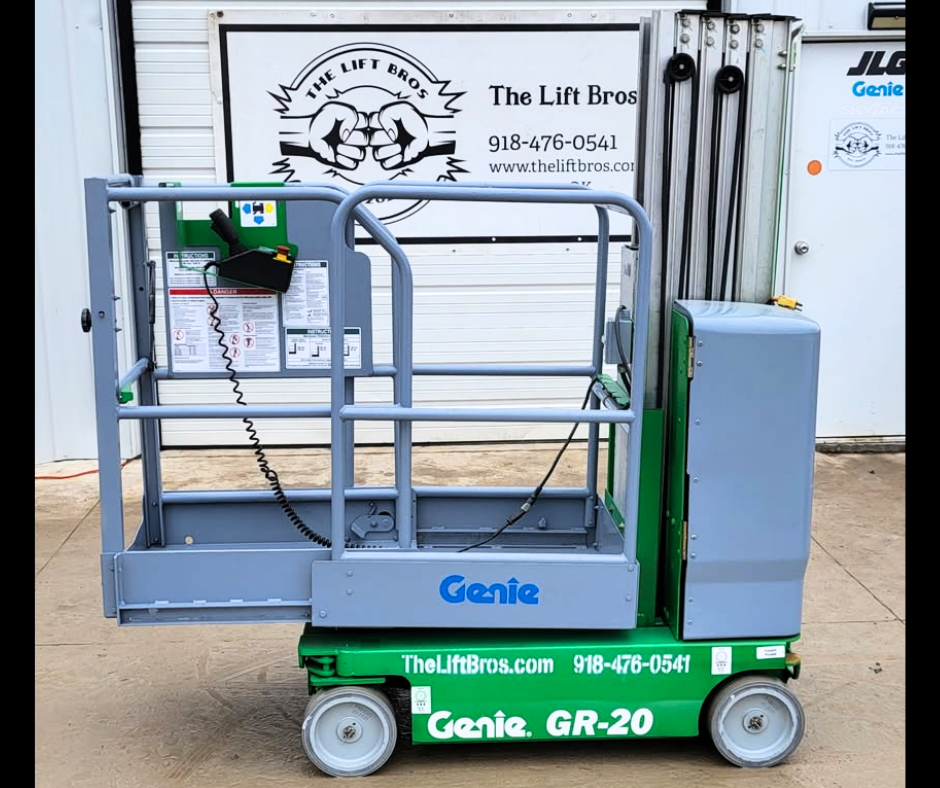 Genie GR-20 vertical mast lift, side view: green base, gray platform with guardrails and coiled control cord