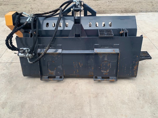 Back of the landscape rake: universal quick-attach plate, hoses and yellow drive motor at left, drive chain on the end
