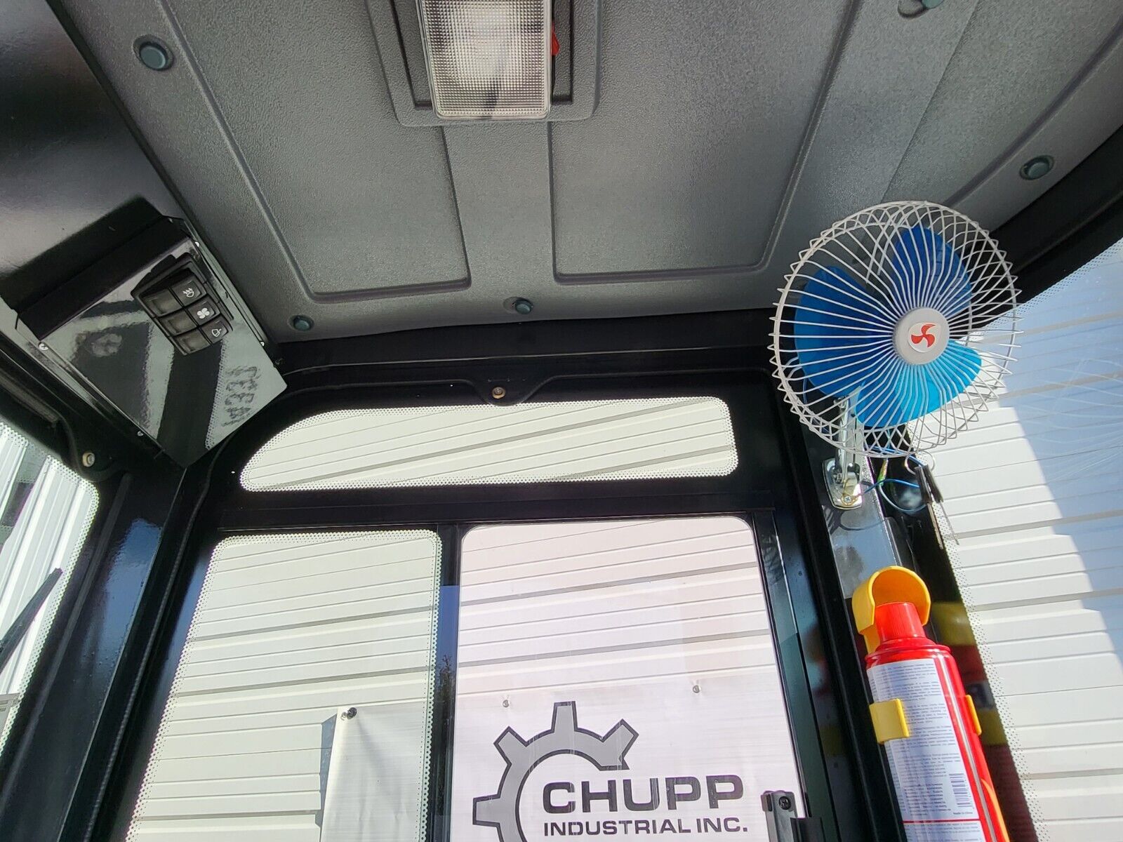 FF13 mini excavator cab: dome light, mounted oscillating fan, switch panel and a fire extinguisher
