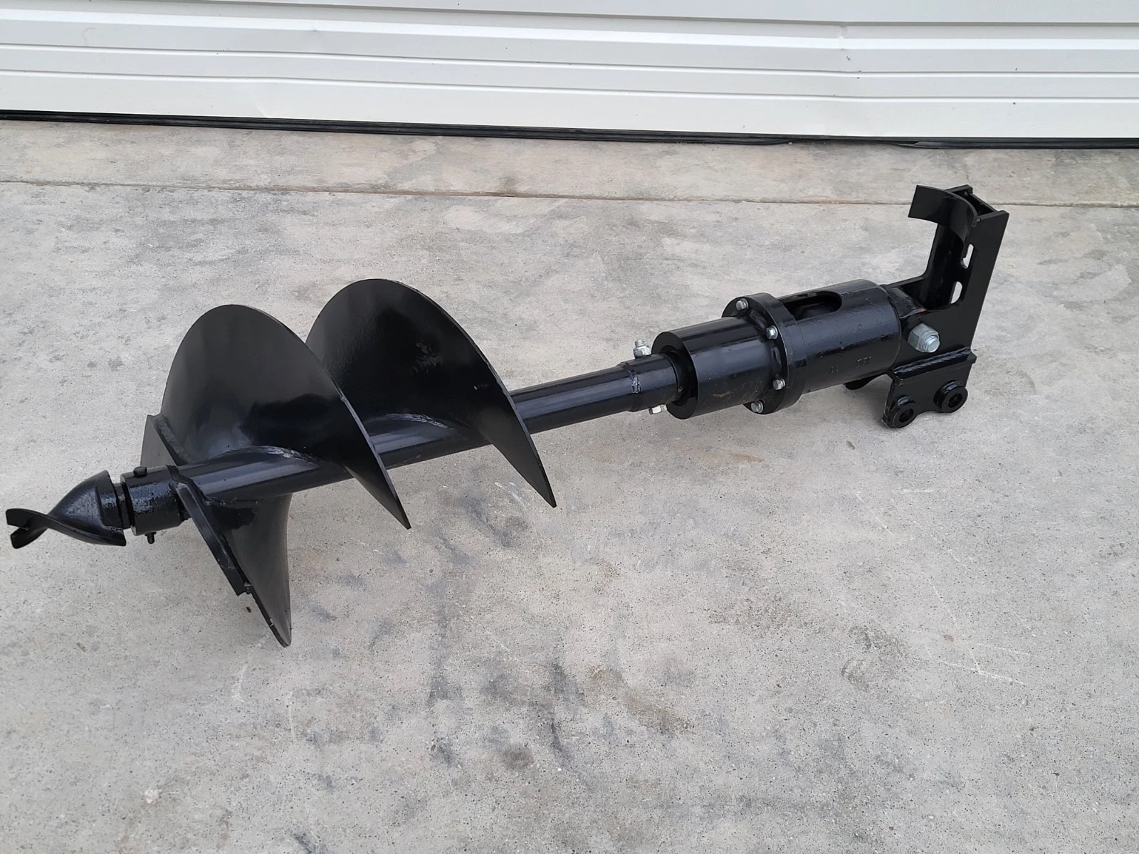 Hydraulic auger assembly end to end: 16-inch flighted bit, shaft, drive housing and mounting bracket