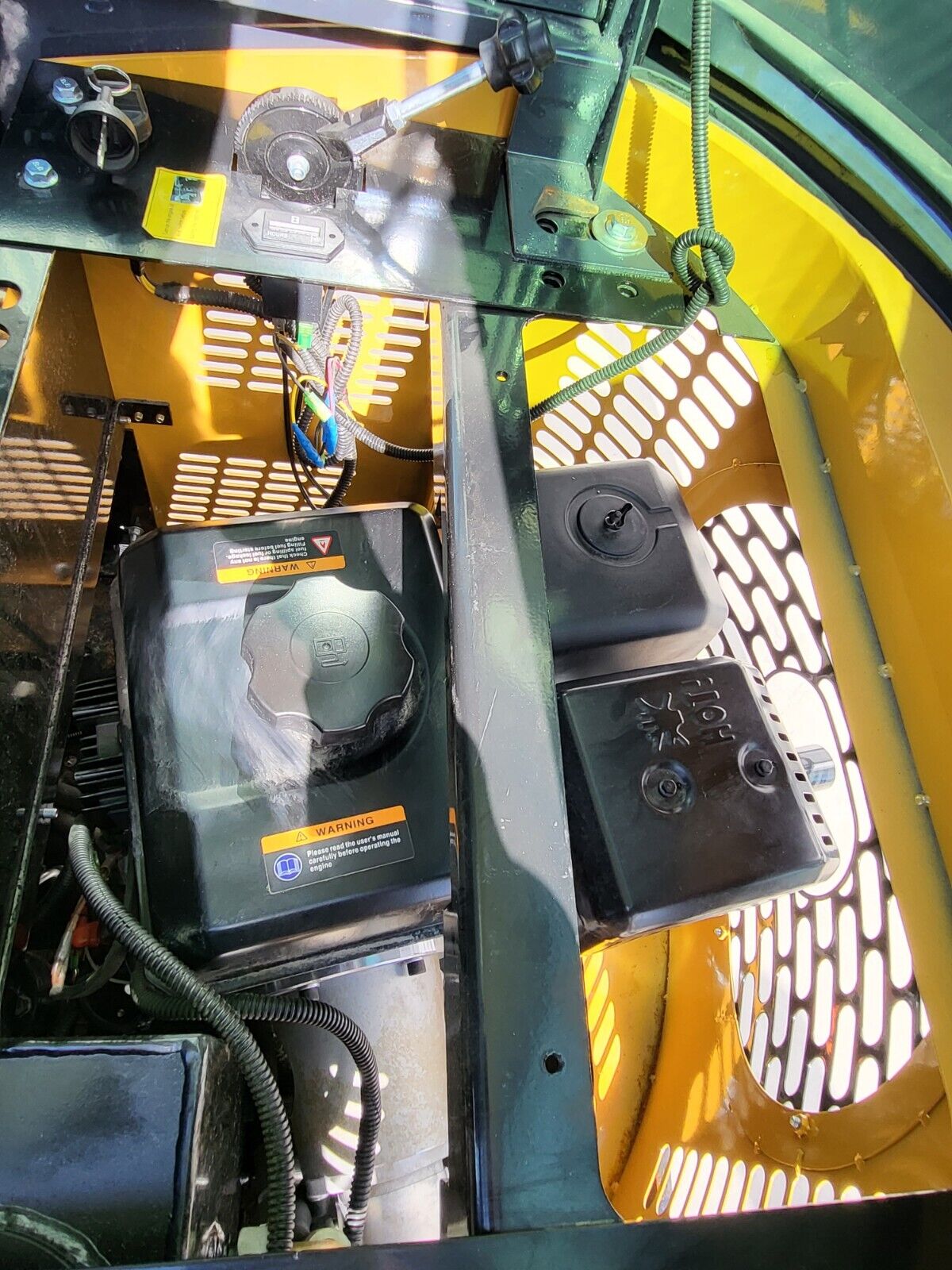 AGT H13R engine bay open: fuel tank and cap, air cleaner, HOT muffler cover, key switch and hour meter above