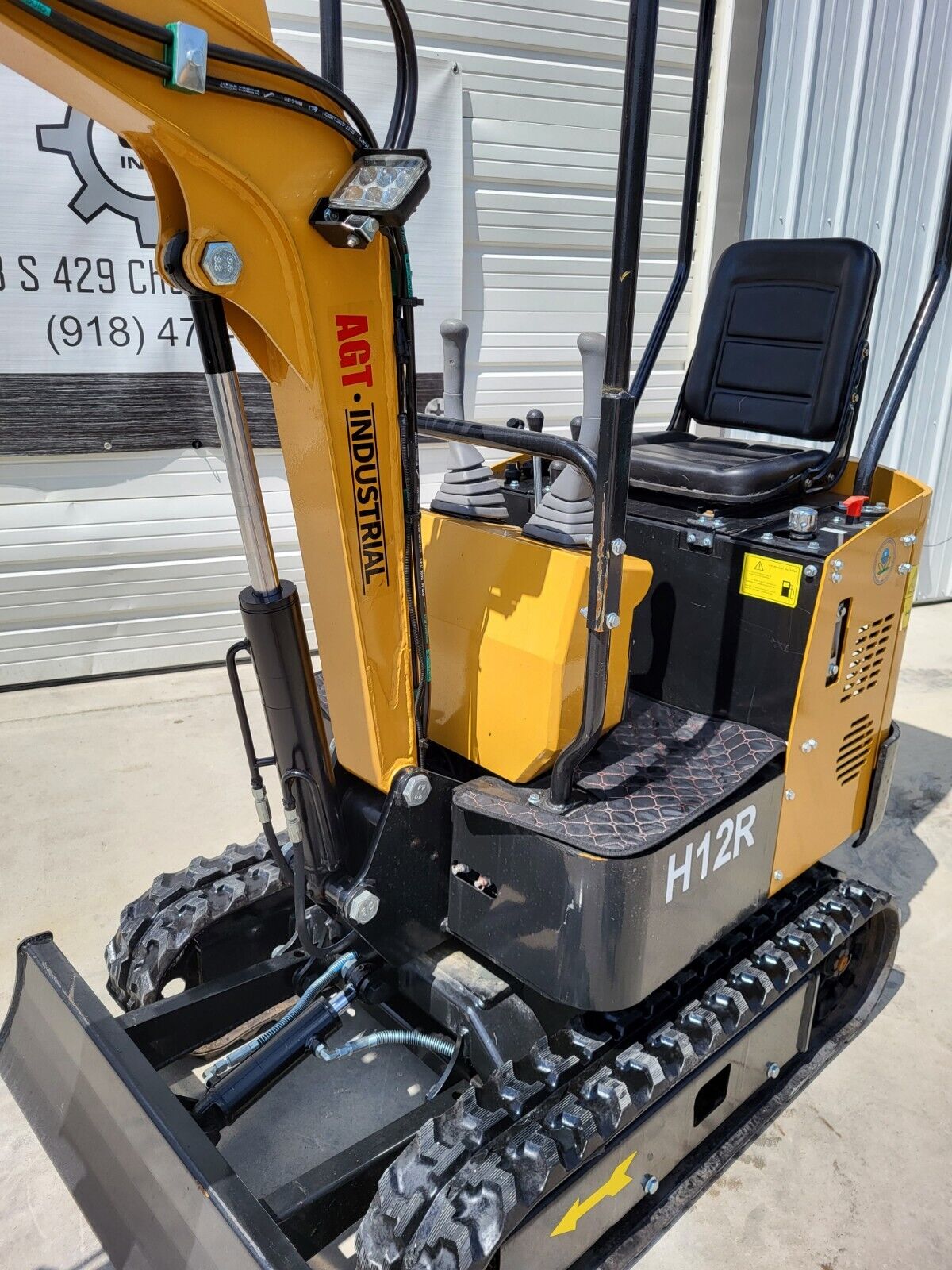 AGT H12R mini excavator boom with LED work light, open seat and joysticks, backfill blade and rubber tracks