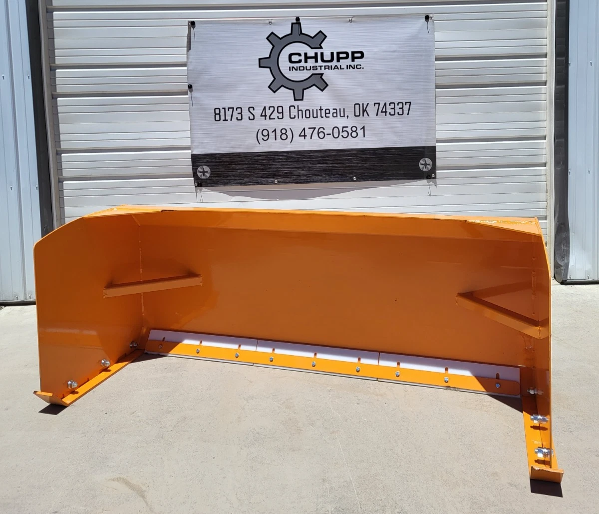 Orange 84-inch snow plow blade, white poly cutting edge and bolted end plates