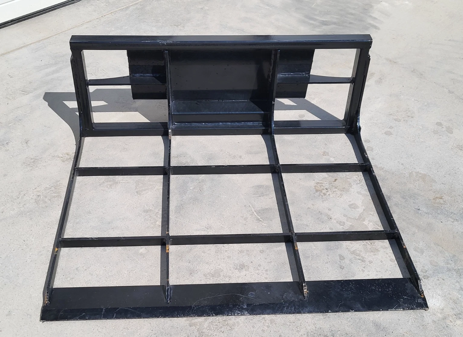 Black steel land leveler, open grid frame with cross bars and flat cutting edge