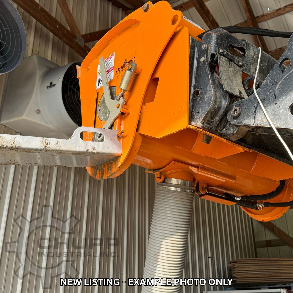 Landhonor cement mixer bucket on skid steer arms, discharge chute and hose below the drum; example photo