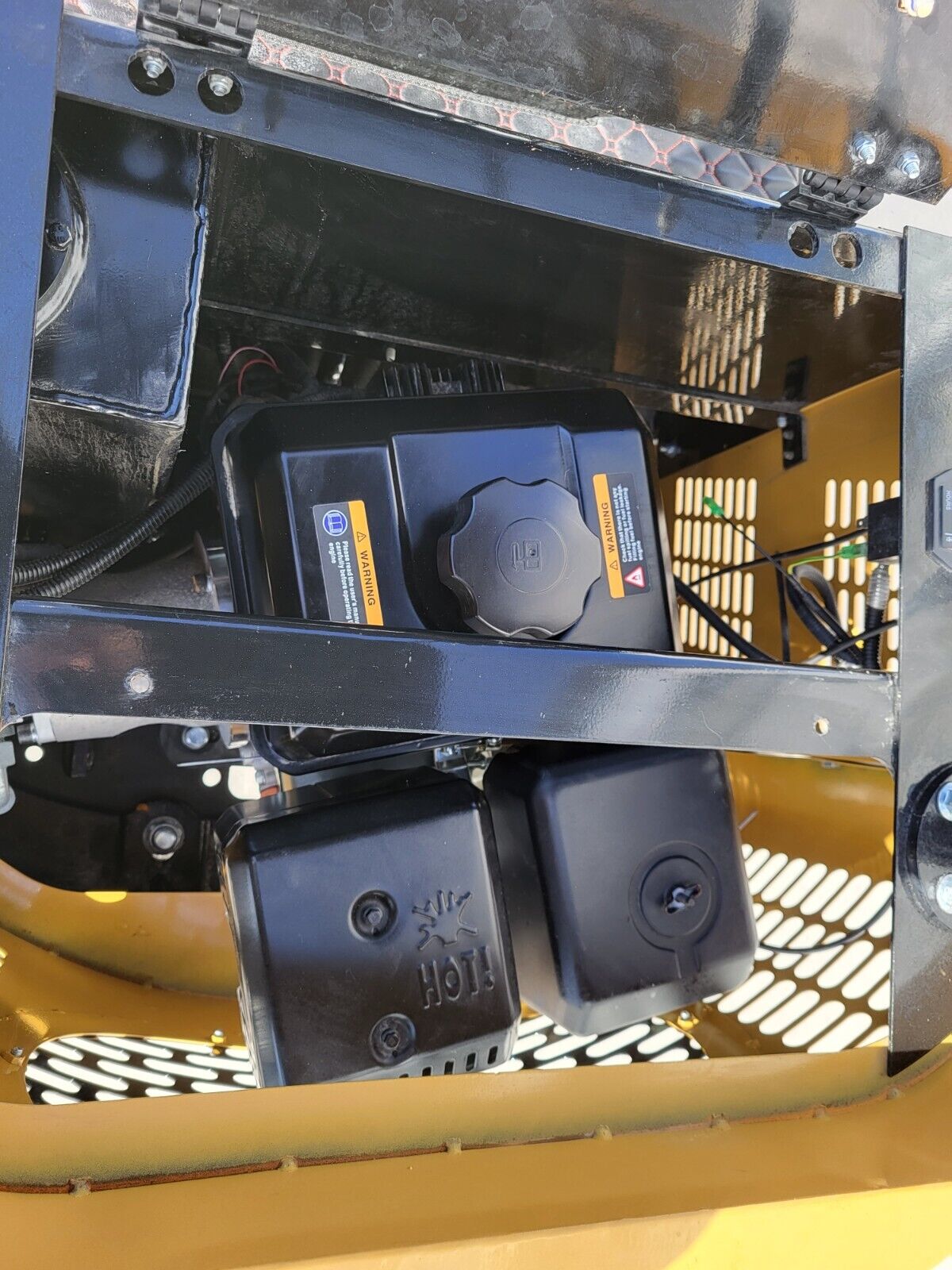 AGT H12R mini excavator engine bay under the seat: fuel tank and cap, air cleaner and shielded muffler