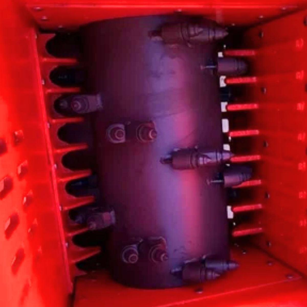 Raytree 72in block crusher rotor: carbide-tipped teeth on the drum inside the red crushing chamber