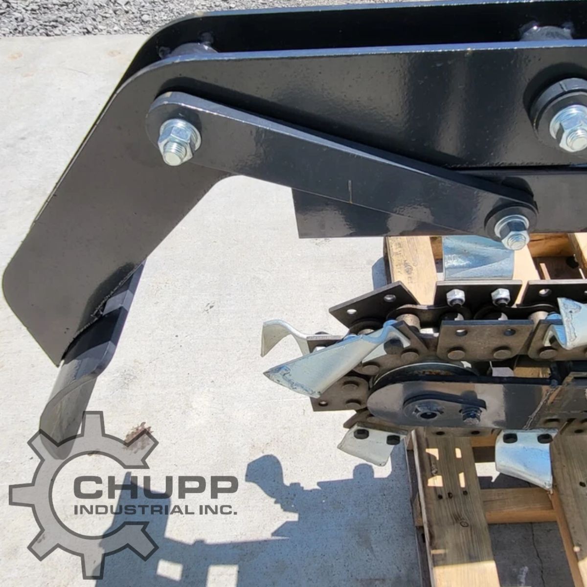 Wolverine trencher boom end and crumber shoe, bolted joints, chain teeth and drive sprocket alongside