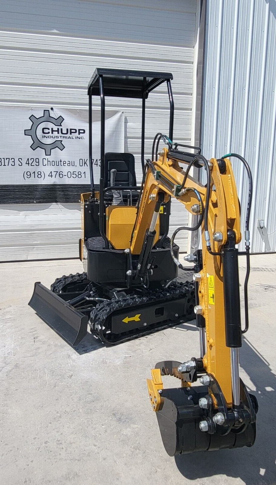 AGT H12R mini excavator boom and hydraulic thumb over the bucket, with the canopy, seat, backfill blade and tracks