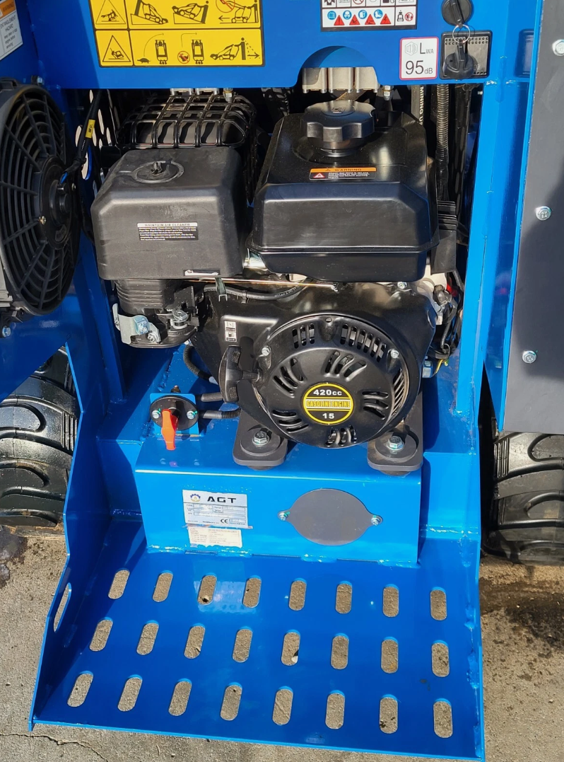 AGT mini skid steer engine bay: 420cc gasoline engine with recoil start and air cleaner, over a perforated step