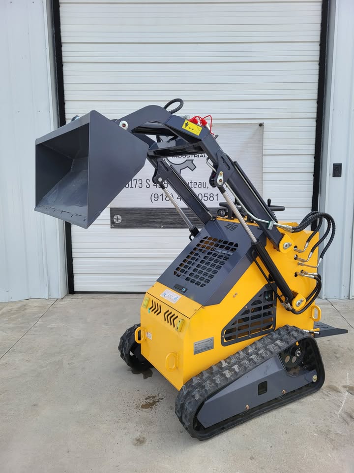 ZJG-380 mini skid steer with bucket raised, rubber tracks, stand-on rear platform and auxiliary hydraulic lines