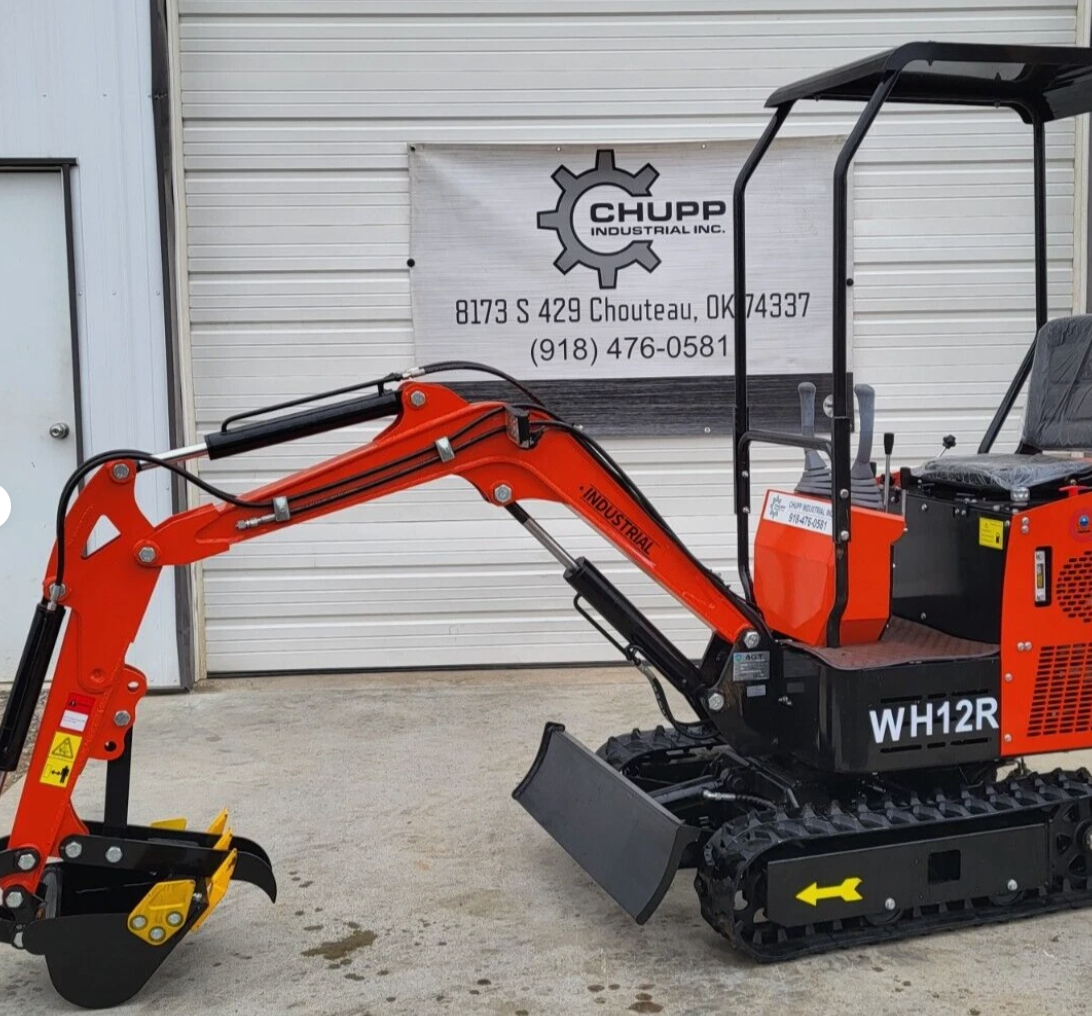 Orange WH12R mini excavator with boom extended, toothed bucket and fixed thumb, backfill blade and rubber tracks