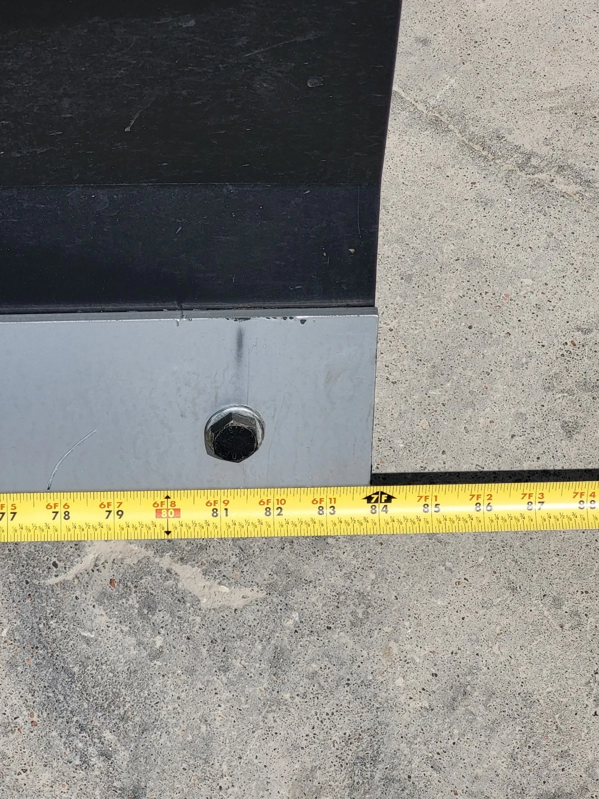 Tape measure up the push blade, reading about 24 inches of blade height