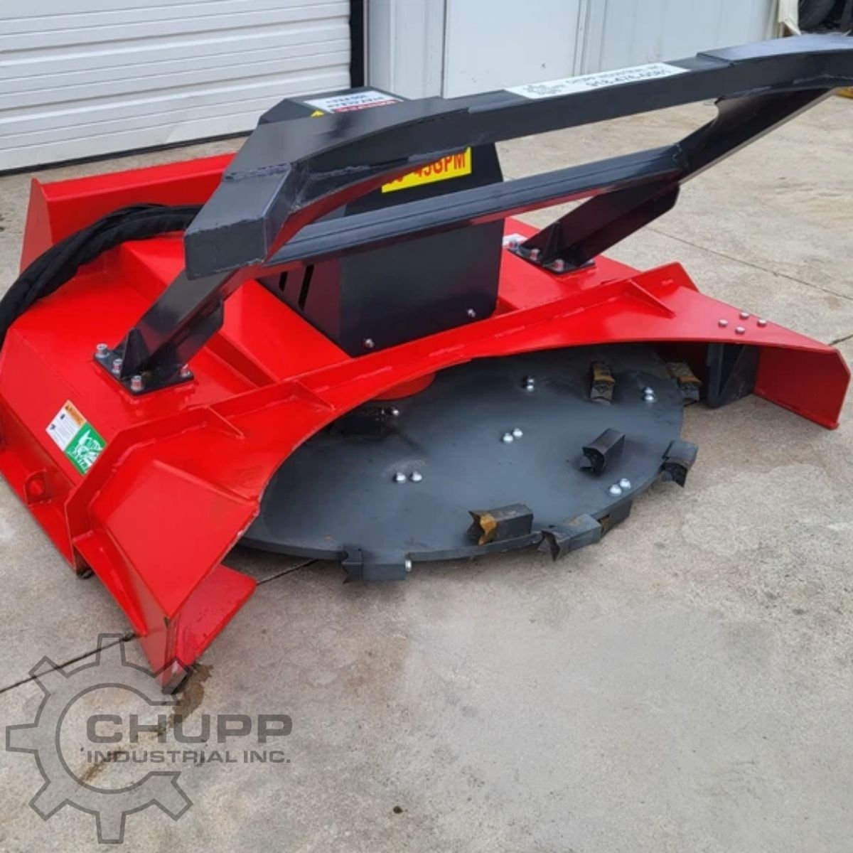 Red disc mulcher: steel cutting disc with bolt-on teeth under the red hood, quick-attach arms and 30-45 GPM decal