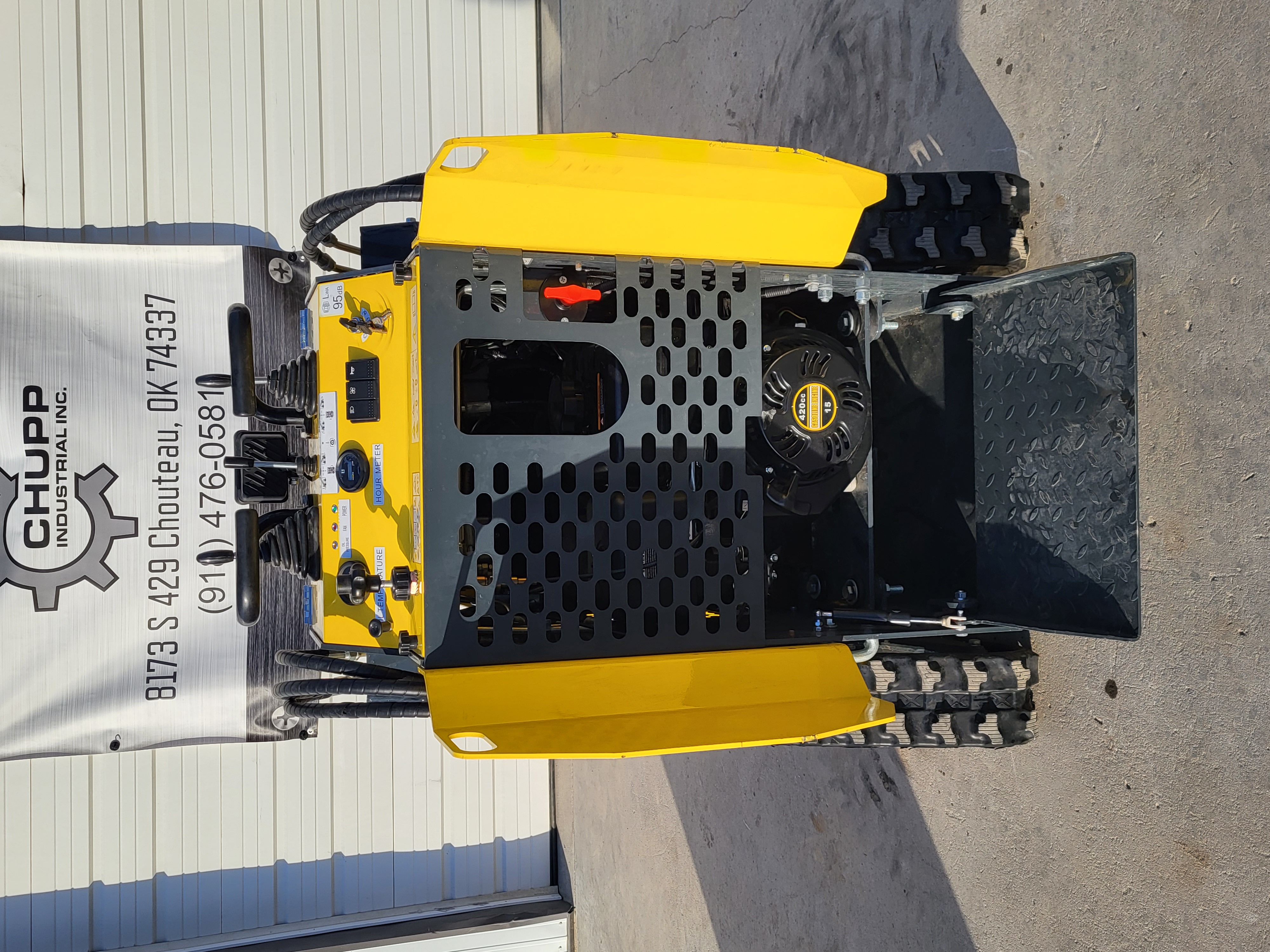EGN EG360 mini skid steer: yellow hood and hand levers, black engine guard over the 420cc gasoline engine, rubber tracks