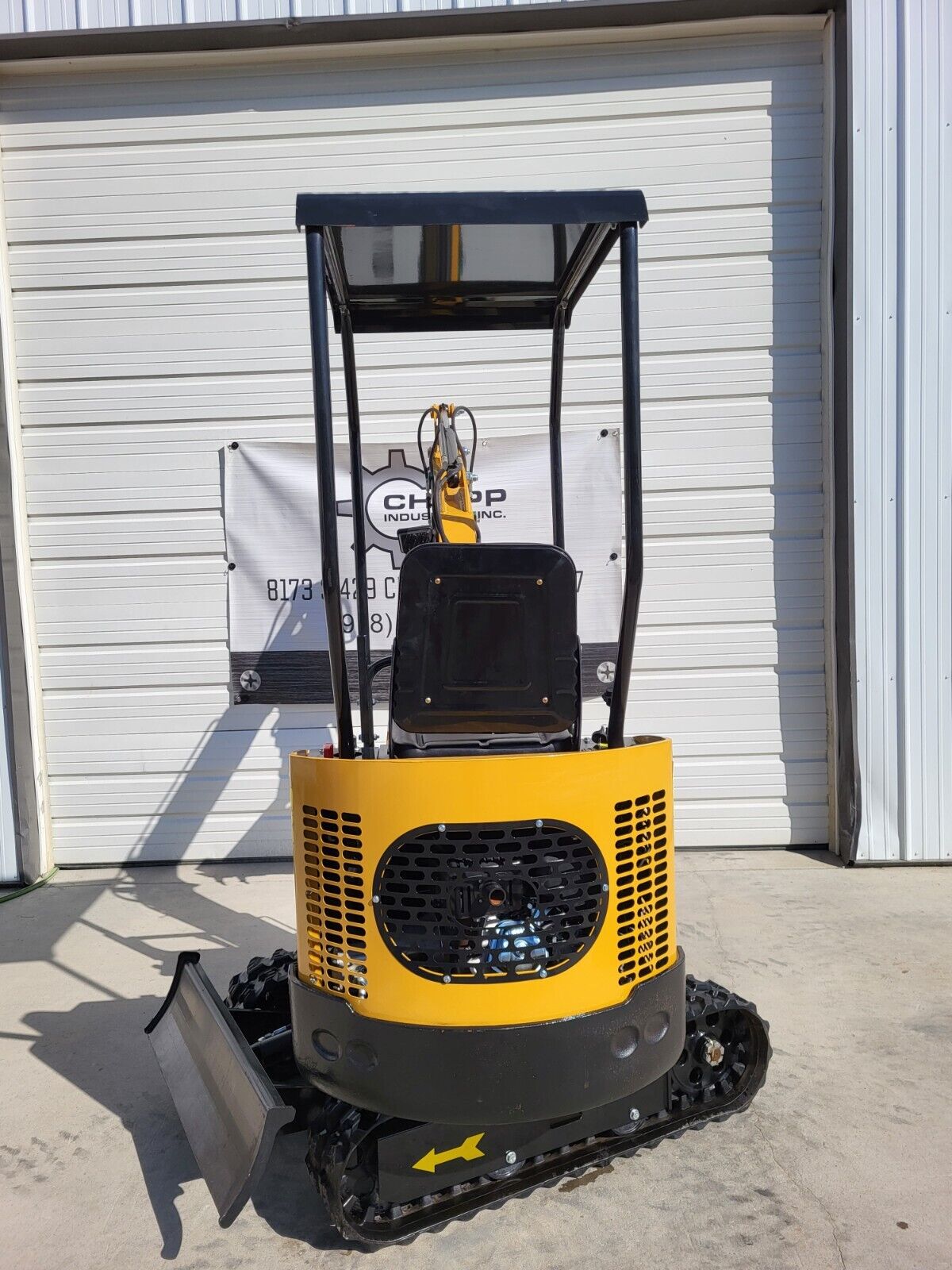 AGT H12R mini excavator rear: vented engine cover and counterweight, canopy roof, seat and rubber tracks