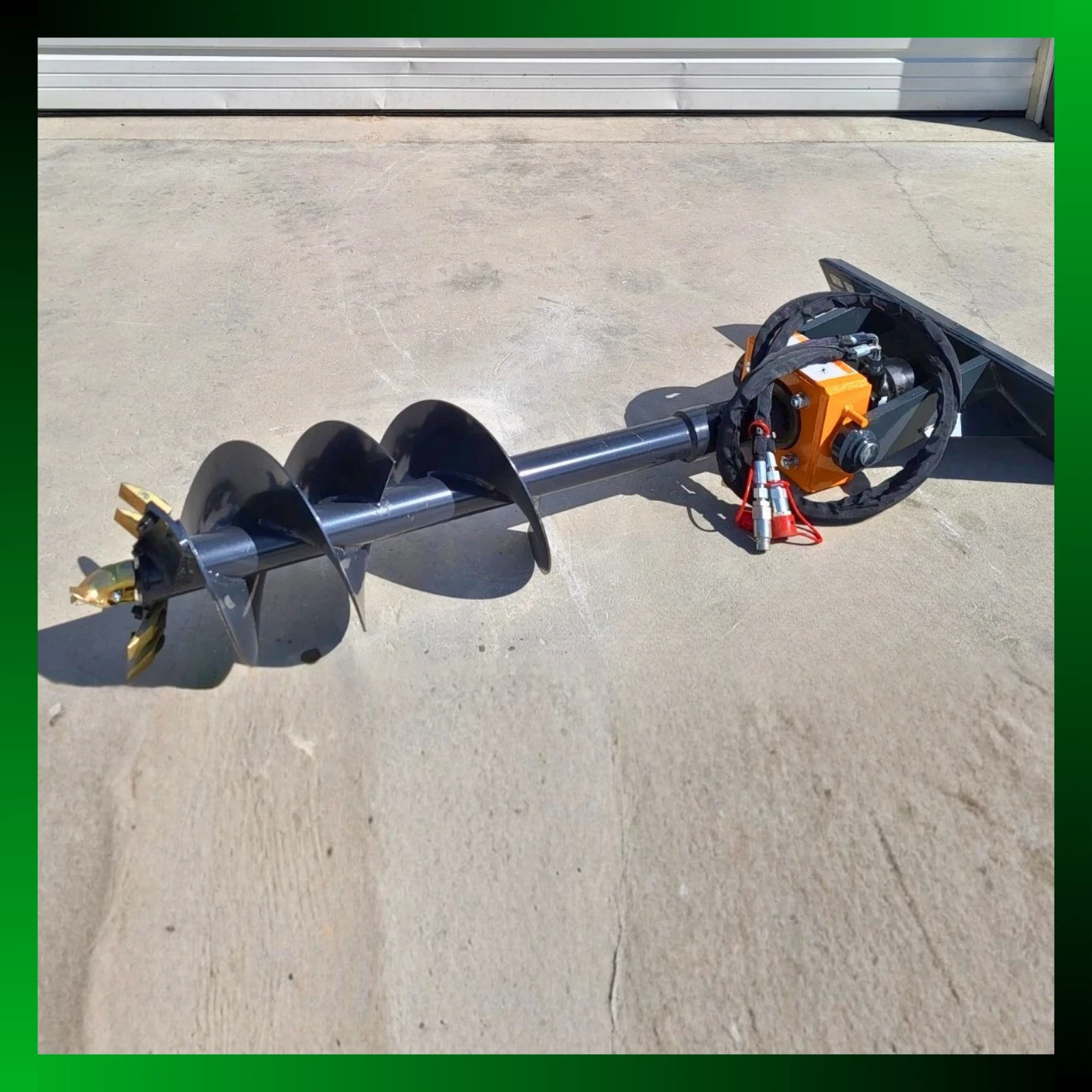 Mini skid steer auger full length, black flighted bit and orange drive on the mount plate, green border
