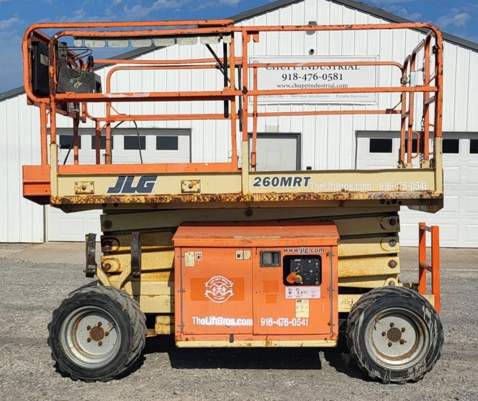 JLG 260MRT rough terrain scissor lift with guardrails up, side engine access panel and four-wheel-drive lug tires