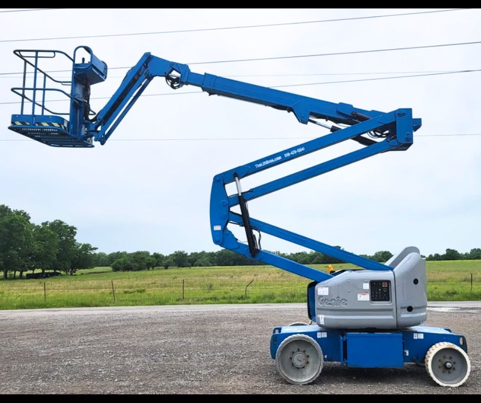 Blue Genie articulating boom lift, boom raised and extended with the work platform out front at head height