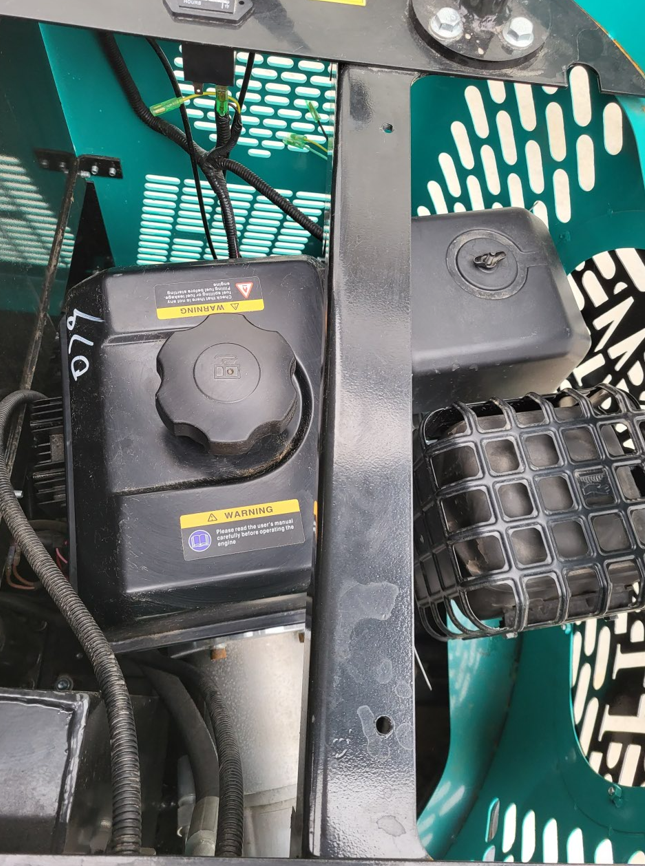 WH12R engine bay with gasoline fuel tank cap, air filter housing and intake grille