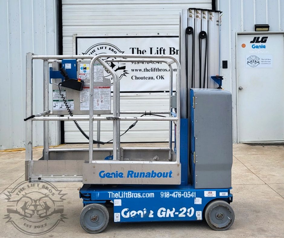 Genie GR-20 Runabout vertical mast lift in blue, guardrailed platform, hand controller on a coiled cord, mast lowered