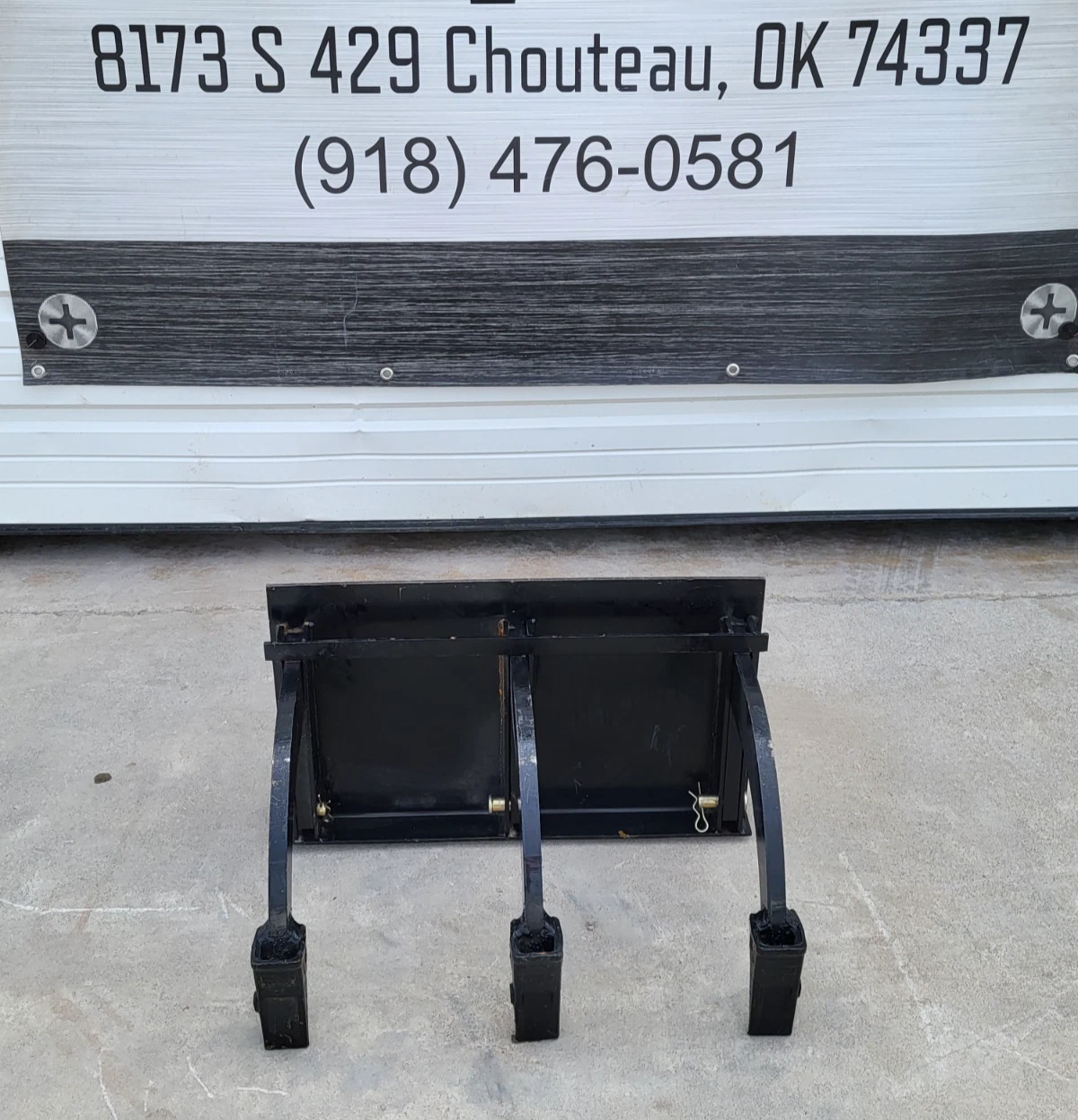 Three-shank mini skid steer ripper, curved steel shanks and mount plate, below the Chupp Industrial banner