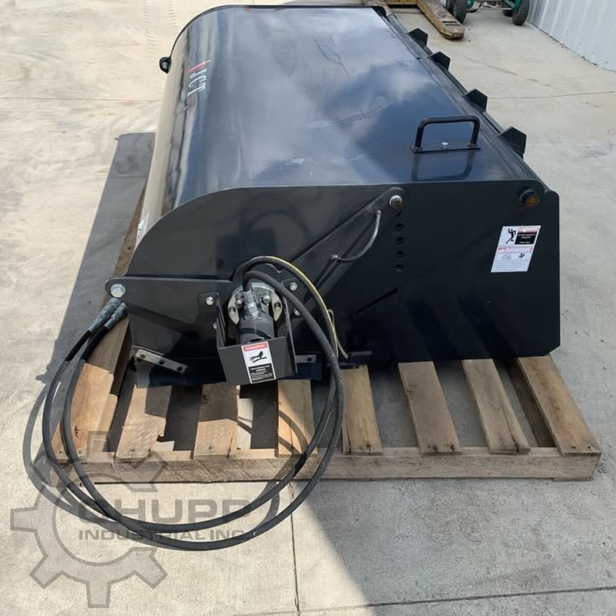 JCT 72in box broom with its direct-drive hydraulic motor and coiled hoses at the end of the hopper
