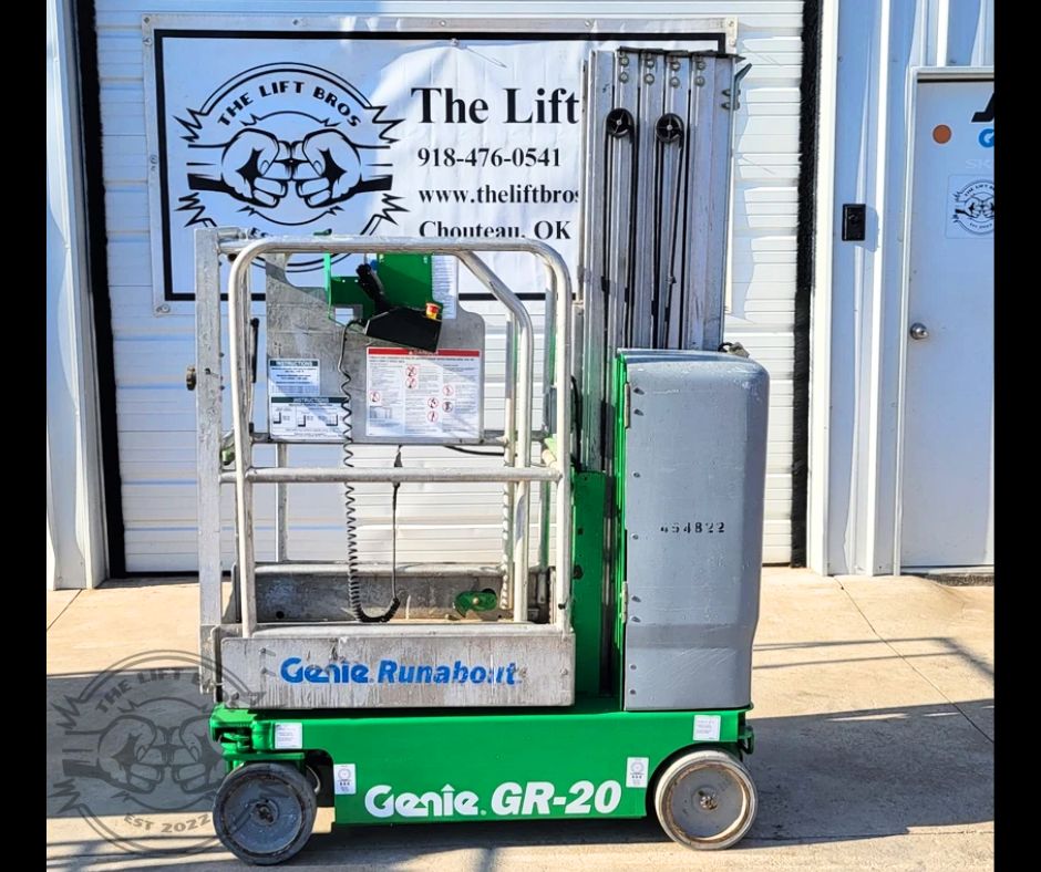 Green Genie GR-20 Runabout vertical mast lift, platform lowered, control panel and guardrails, gray battery cover