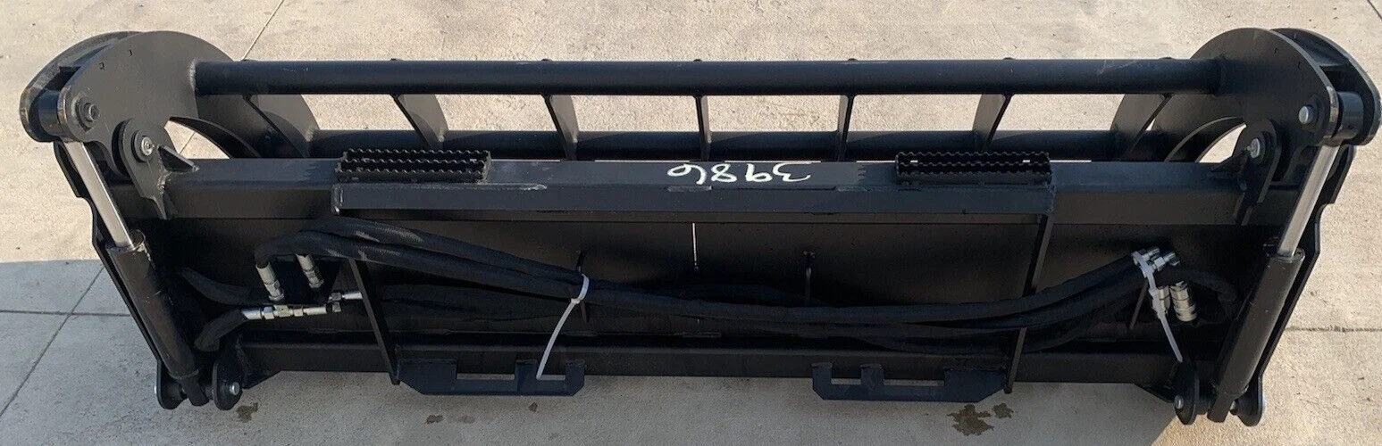 78-inch rock grapple bucket from behind, quick-attach plate, hydraulic cylinders and hose runs