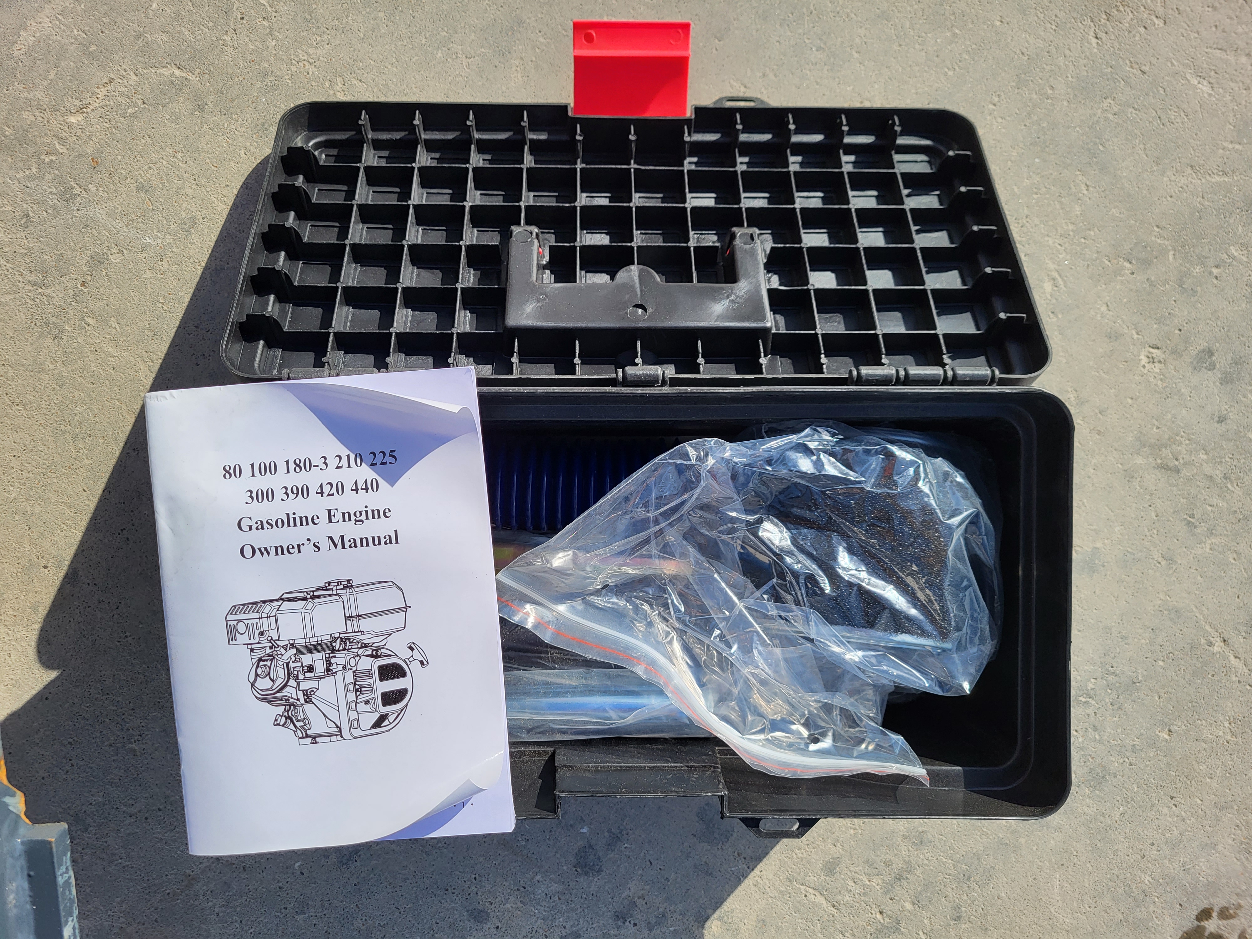 AGT YSRT14 tool kit: black toolbox with the gasoline engine owner's manual, a spare air filter and bagged small parts